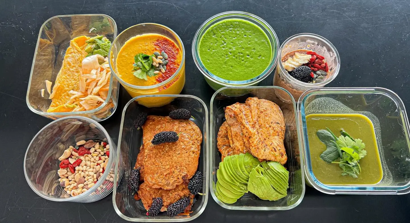 Salmon with colourful prepared sides and salads